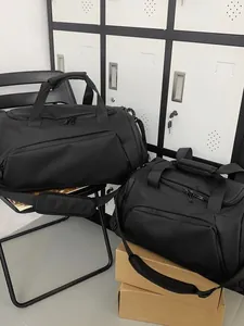 Large capacity black sports duffel bags in two sizes for fitness and travel use