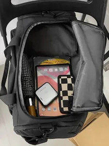 Large black fitness travel bag with high capacity compartments for tech and essentials