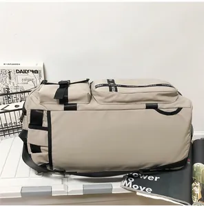 Detail showing the large capacity khaki travel bag with waterproof fabric and multi-pockets