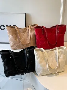 Minimalist quilted tote bags in velvet available in beige, red, black, and white colors