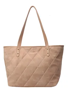 Quilted tote bag in light brown plush fabric with spacious interior for daily commute