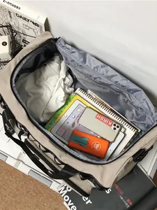 Large capacity travel duffel bag in beige with multi-compartment storage for electronics