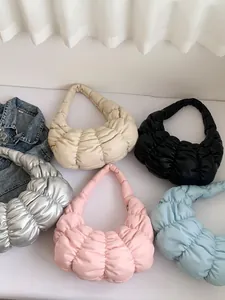 Quilted dumpling cloud bag in multiple colors featuring stylish pleated puffer texture