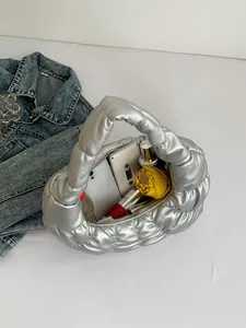 Metallic silver quilted cloud bag with large capacity showing interior storage items