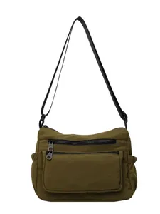 Versatile army green nylon crossbody bag with dual front zippers and adjustable strap