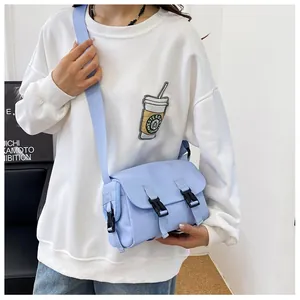 Adjustable light blue crossbody messenger bag featuring durable nylon and buckle closures