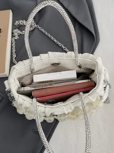 White pleated cloud bag with silver rhinestone handle and pearl chain shown with large capacity