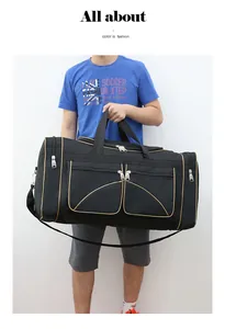 Detail of black large capacity travel bag with champagne trim and dual zip pockets