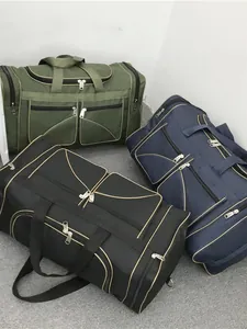 Large capacity nylon travel duffel bag with multiple pockets in green, navy, and black