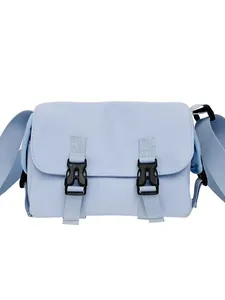 Light blue nylon messenger bag with black plastic buckles and wide shoulder strap