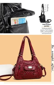 Detail of the side button pocket and layered storage design on this soft leather bag