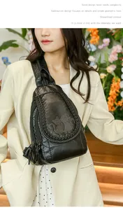 Close-up of black pebble leather sling bag featuring a unique rivet cat pattern design