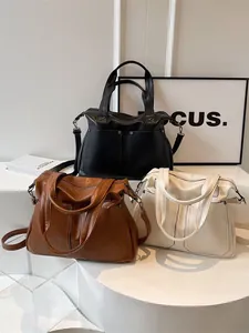 Three-piece set of retro tote bags in black, brown and beige soft leather with rivet pockets