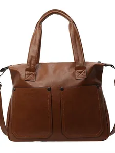 Vintage caramel brown tote bag with decorative pockets and durable double handles