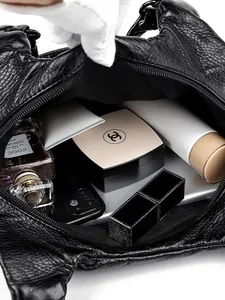 Black leather shoulder bag with large capacity, multi-layer interior and smooth zipper