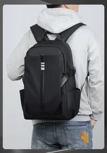 Detailed view of black water-resistant backpack straps and side pocket on a male model