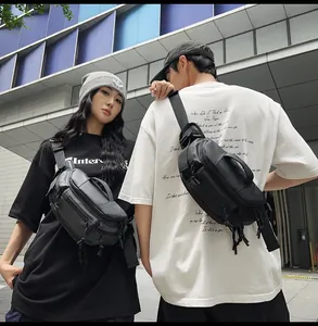 Outdoor street style shot showing waterproof black crossbody chest bags for men and women