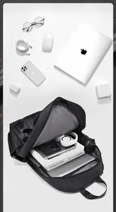 Macro detail of the spacious interior compartment showing laptop and tech organization