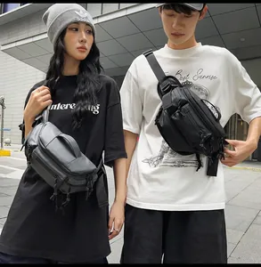 Detail showing two models wearing large-capacity gray and black crossbody chest bags