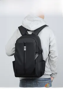 Modern black casual backpack on male model showing minimalist business design and sleek style