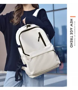 Close-up of a cream water-resistant backpack with hidden zipper and side pocket details