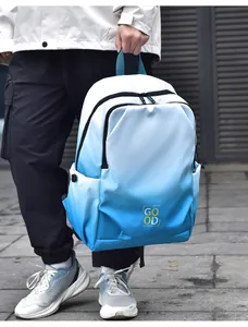 Outdoor hand-held shot of blue gradient backpack with Good Luck text and waterproof zippers