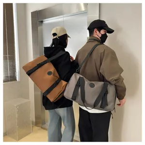 Waterproof large capacity travel bags in brown and grey colors shown on models