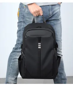 Detailed view of durable black nylon backpack with reinforced handle and water-resistant fabric