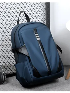 Detail of dark blue waterproof laptop backpack with side bottle pocket and leather texture