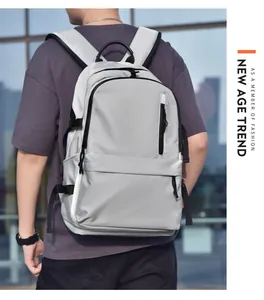 Light grey waterproof backpack with padded straps and large main compartment on a model