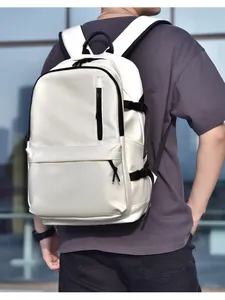 White waterproof backpack detail showing the front zipper pocket and side buckles