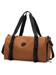 Waterproof travel duffel bag in tan nylon with reinforced buckles and shoe compartment
