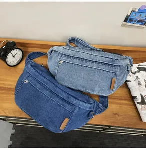 Close-up of denim crossbody bags in light and medium blue with fashion leather patch
