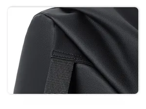 Detail of reinforced triangle stitching on black water-resistant nylon backpack straps
