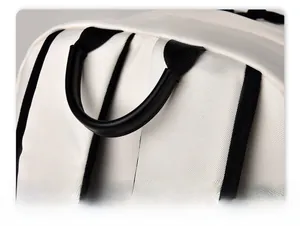 Close-up of a white backpack showing a comfortable black reinforced handle and twill fabric