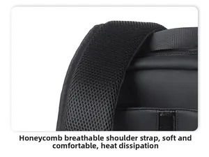 Macro detail of breathable honeycomb mesh shoulder straps on a black travel backpack