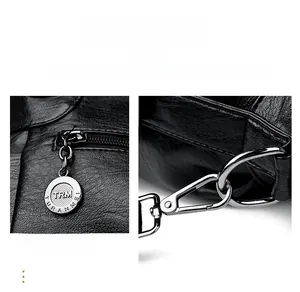 Detail view of silver hardware latch and branded metal zipper on black lychee leather bag