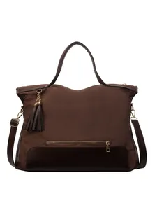 Brown canvas and leather tote bag with tassel accent and gold zipper for women