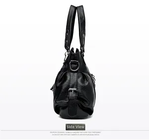 Side view of black large tote bag with oily texture leather and metal D-ring hardware
