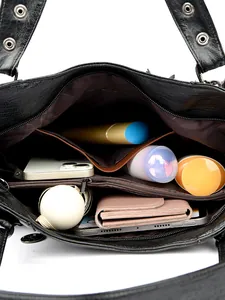 Large capacity black pebble leather tote bag featuring spacious internal compartments