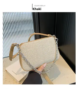 Detailed close-up of khaki woven handbag featuring silver chain handle and leather trim