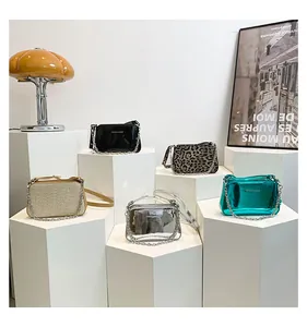 Detailed view of various textures including metallic, leopard print, and woven shoulder bags