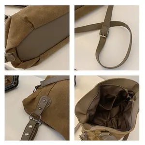 Détails du cabas en toile avec boucles métalliques, brides en cuir et poches intérieures