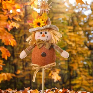 Harvest scarecrow garden stake with sunflower straw hat and autumn maple leaf decor