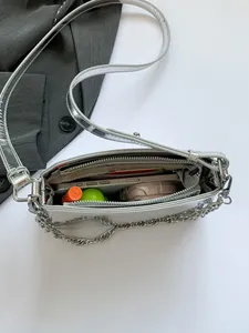 Metallic silver large capacity shoulder bag with chain strap and spacious interior