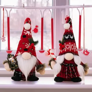 Detail of Christmas gnomes with candy cane and lantern in festive knitted outfits