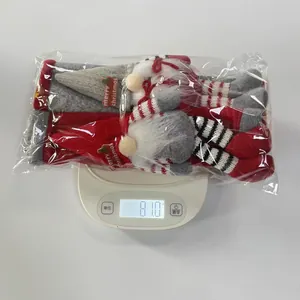 Gnome refrigerator handle covers in red and grey shown on an electronic scale weighing 81g