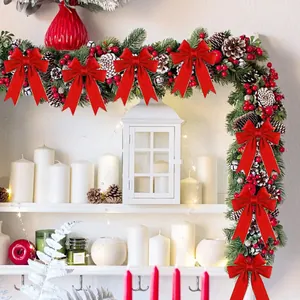 Red glitter Christmas bows with gold wired edges on a festive holiday wreath