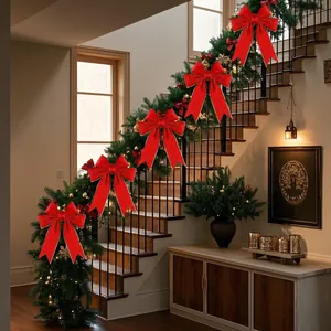 Five large red sequin velvet Christmas bows decorated on a green staircase garland