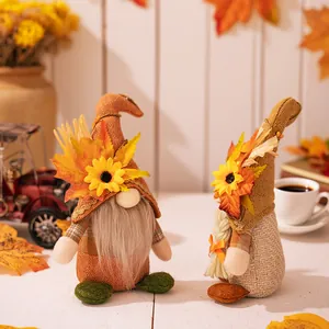 Pair of autumn gnomes with sunflowers and maple leaves for Thanksgiving home decoration